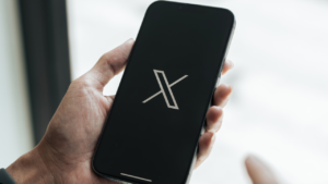 X, Chris Riedy, Elon Musk
